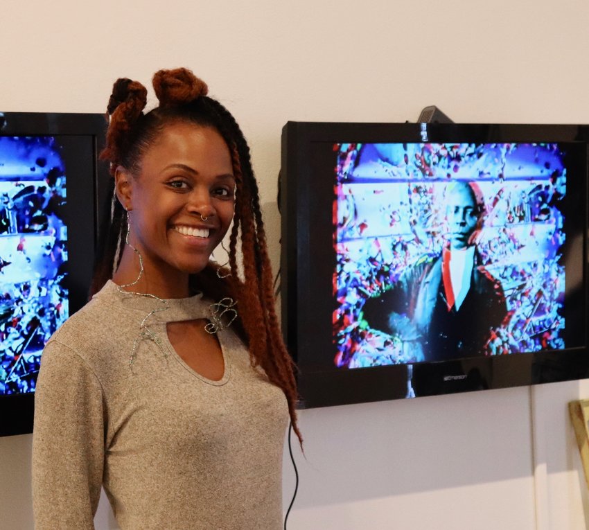 Artist Juannean Young used her smart phone to create her digital art display, which combines 3D art and music. Young found the Reach Studio about two years ago after quitting her previous job to become an artist. “Since I’ve been at RedLine, I’ve sold the most art I’ve ever sold,” said the Aurora resident. “It’s proving to people you don’t have to starve to do what you love.”